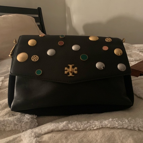 Tory Burch—100% leather. This bag has lots of room, three pockets. - Picture 5 of 10